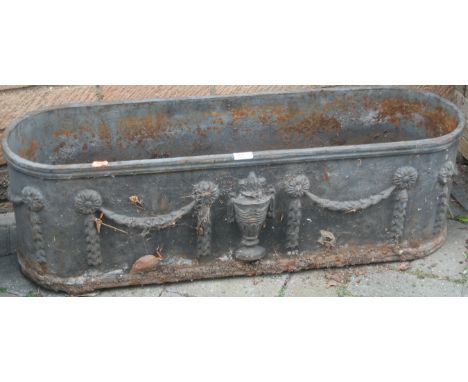 A cast iron oval planter, in the Adam style 