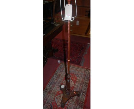 An early Victorian rosewood polescreen (later converted into a standard lamp)