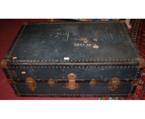 A metal bound hinge top travelling trunk