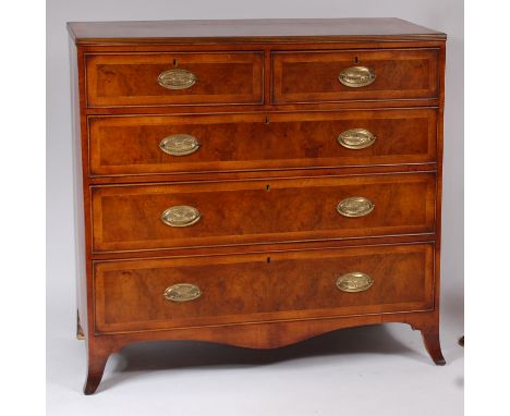 A figured walnut and crossbanded chest, in the early 19th century style, having two short and three long graduated drawers, o