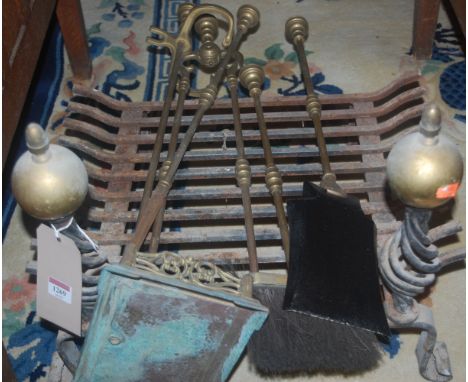 A wrought iron fire basket, together with sundry fire tools on stand