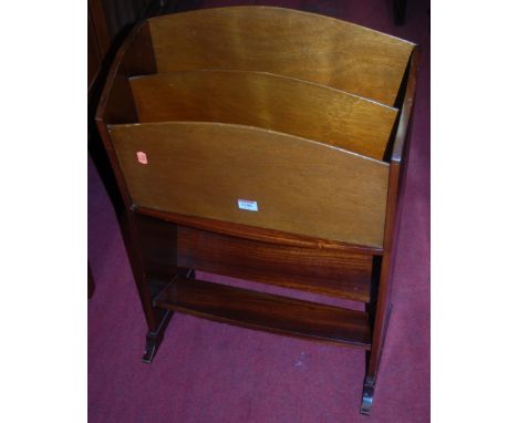 A 1960s teak magazine rack with integral book trough undertier