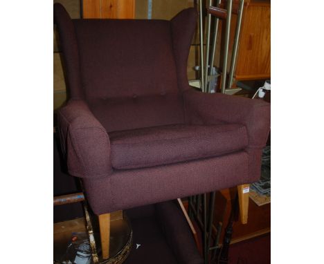 A 1960s Danish beech framed three piece suite, comprising three seater sofa, wing armchair, and a further armchair, all butto