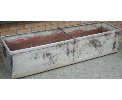 A galvanised metal and later painted livestock feeding trough, of long form (later converted into a planter), length 186cm