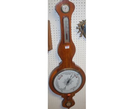 A 19th century mahogany onion topped four dial wheel barometer
