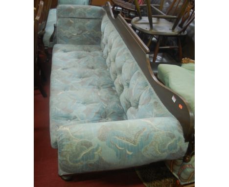 A Victorian mahogany and blue floral buttonback upholstered three-seater scroll end sofa 