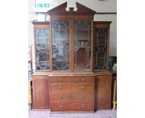 GEORGIAN MAHOGANY BREAKFRONT FOUR DOOR ASTRAGAL GLAZED BOOKCASE (AT FAULT)