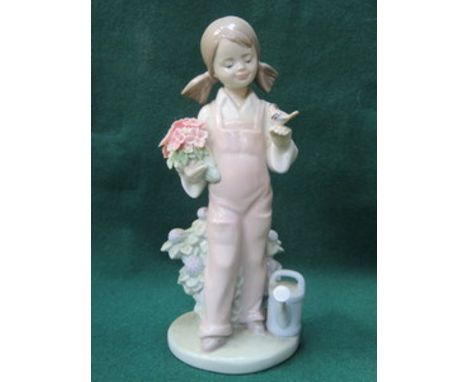 LLADRO GLAZED CERAMIC FIGURE OF A GIRL WITH WATERING CAN AND FLOWERS APPROXIMATELY  19cm HIGH 
