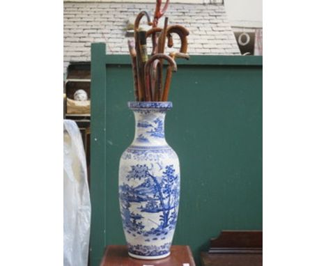 BLUE AND WHITE LARGE CERAMIC VASE AND PARCEL OF VARIOUS WALKING STICKS 