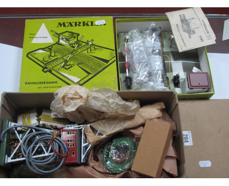 A Marklin "HO" Gauge Ref No. 7192 Level Crossing with Powered Barriers, boxed, good. Plus a Marklin Ref No. 7051 Electric Goo