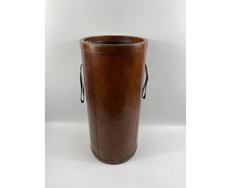 A good quality leather bound cylindrical stick stand, 28 x 62cms. Estimate £30-50.
