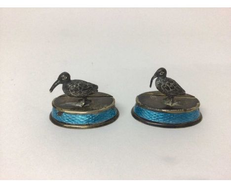 An Edwardian pair of silver and enamel menu holders, (London 1910, William Horton), 4cm wide

Some tarnishing which could pro