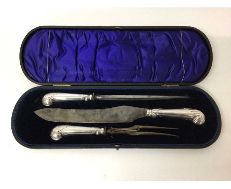Good quality late Victorian silver handled carving set with pistol grips decorated with scrollwork ( Sheffield 1899) in fitte