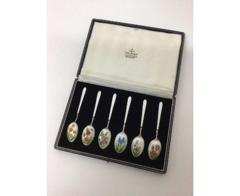 Cased set of six sterling silver and enamelled tea spoons, each decorated with different flowers on a white ground (Birmingha