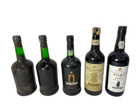 Five bottles, Sandeman Port 1989, another Ruby, two bottles lacking labels and a bottle of Sandeman Olorosso Sherry