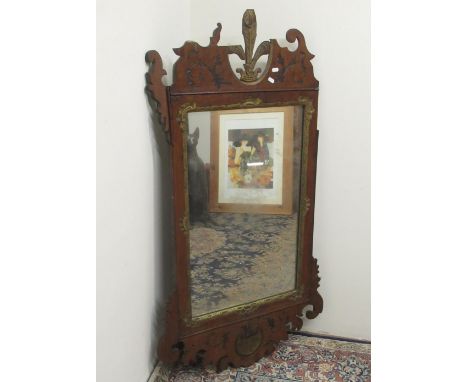 Large Chippendale style wall mirror, parcel gilt mahogany frame with fleur-de-lys cresting and shell detail, H131cm W73cm 