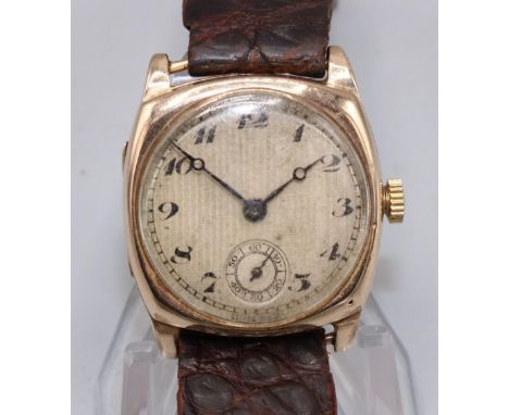 Swiss gold wristwatch, silvered engine turned Arabic dial with subsidiary seconds, cushion case with snap on bezel and hinged