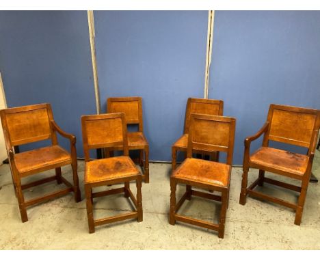 Robert Mouseman Thompson of Kilburn - a set of six (4 + 2) oak dining chairs, with adzed panel backs, and brass nail leather 