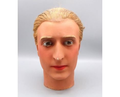 Early C20th male French wax mannequin head, with real hair, glass eyes and painted face, c1930s, H27cm 