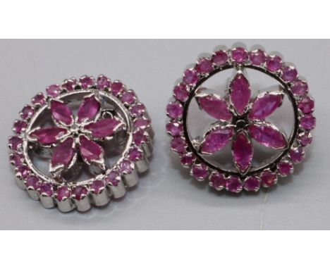 Silver and ruby floral earrings, the round fronts each set with twenty three round and six marquise cut rubies, stamped 925, 