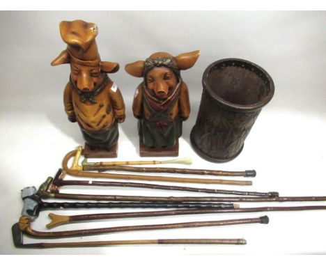Collection of walking sticks and a golf putter stamped 'J Kay Seaton Carew Special'; faux leather stick stand; and two hollow