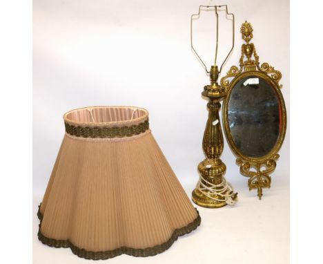 C20th gilt Rocco style table lamp H83cm and a C20th Neo Classical brass framed oval mirror H69cm (2) A/F 