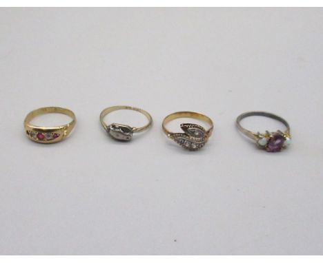 9ct yellow gold ring set with red and clear stones, size K, stamped 375, a yellow metal ring with leaf front design set with 