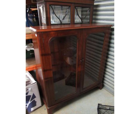 Victorian mahogany bookcase, with two glazed doors and three adjustable shelves on bracket feet, W120cm D33cm  H131cm 