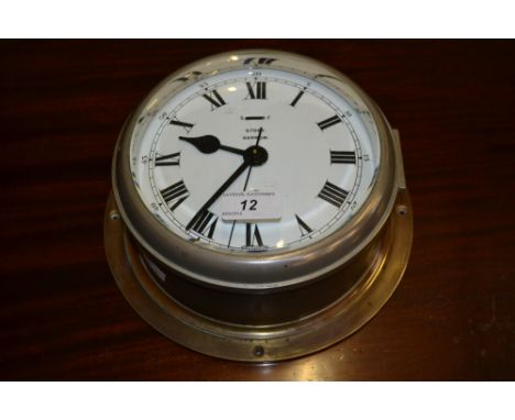 A Story of Barrow ships bulk head clock, white enamel dial, Roman numerals, outer minute track, centre hours, eight day movem