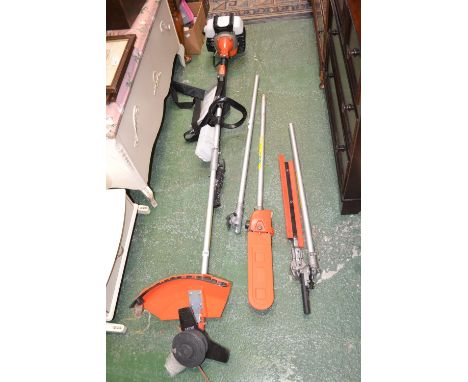A Nordstrom 2 stroke bush cutter, with accessories including chainsaw and hedge cutter.