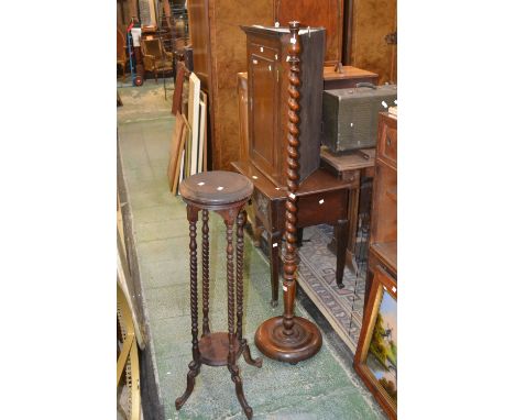 A mahogany jardiniere stand, circular top, four rope twist supports, undertier, French cabriole legs; a 1940's oak barley twi