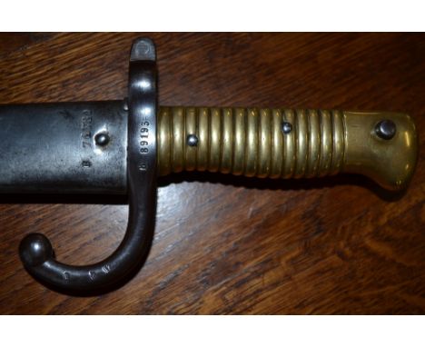 A 19th century chassepot bayonet and scabbard, brass hilt, dated 1871, 71cm long