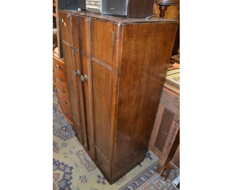 A 1940's oak tallboy