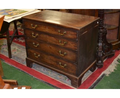 A small George III mahogany chest, moulded rectangular top above four long cockbeaded drawers, brass swan neck handles, brack
