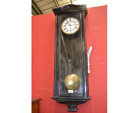 A 19th century ebonised Vienna wall regulator, 17cm circular enamel dial inscribed with Roman numerals, twin weights, 8-day m