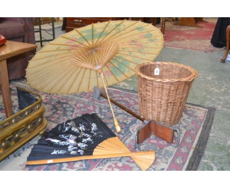 An early 20th century shooting stick; a 1950's Japanese parasol, painted with flowers; a fan; a wicker paper basket