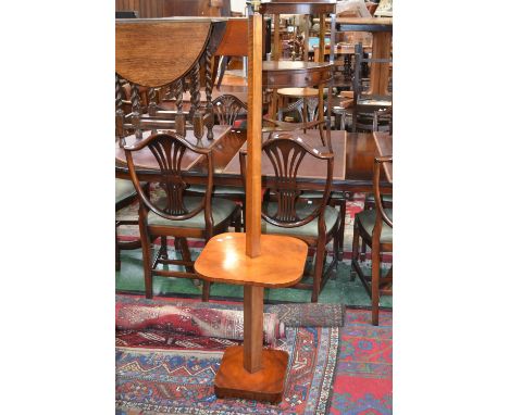 An Art Deco walnut standard lamp with smoker's stand, spreading square column, quarter veneered, rounded square smoker's stan