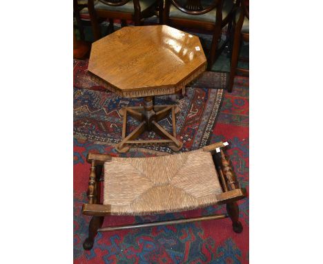 An oak Arts and Crafts style occasional table; an oak rush seated stool, turned handles (2) 