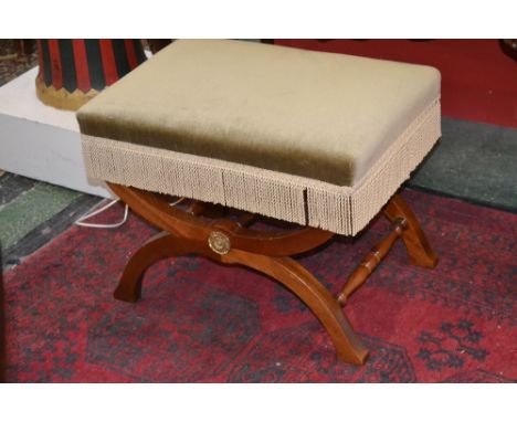 A  X-frame mahogany stool, padded top, brass escutcheon, turned stretchers