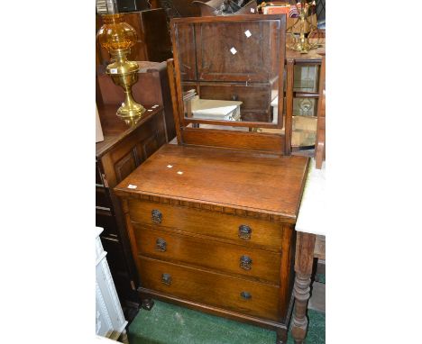A 1940's oak dressing chest, square mirror, three graduated drawers, block feet.