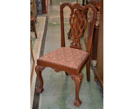Eight Chippendale revival dining chairs, floral cresting top rail, pierced vasular splat, drop seat, cabriole forelegs, ball 