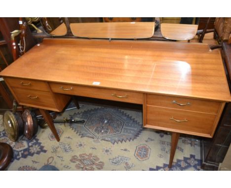 A 1950's/1960's designer retro teak dressing table, with triptych mirror