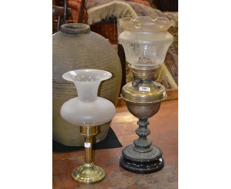A Victorian brass oil lamp ; a brass storm lantern (2)
