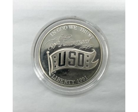 San Francisco Mint. A commemorative issued coin. The obverse side depicts USO pennant with the text 50th Anniversary above. T