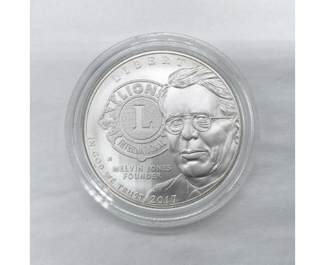 Philadelphia Mint. A commemorative issued coin celebrating the Lions Club International Centennial. The obverse side features