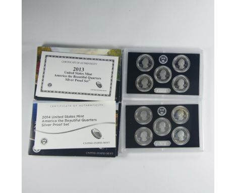 Two US Mint cases, each containing five Silver Proof coins. San Francisco Mint. The quarters obverse side features George Was