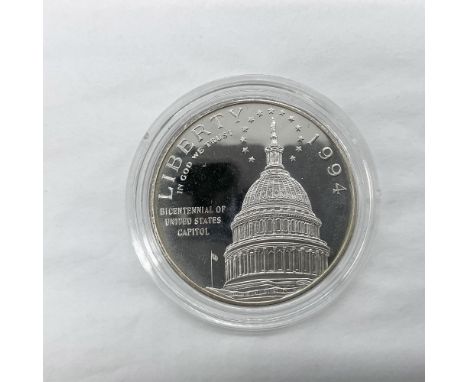 A commemorative issued coin. San Francisco Mint. The obverse side depicts the US Capitol dome with the Statue of Freedom surr