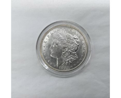 Denver Mint. The obverse side features Liberty in profile. She is shown in cap, flora, and crown. The reverse side depicts an