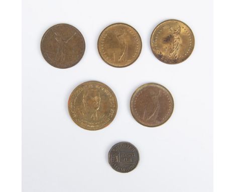 A set of 6 gold colored tokens, including 3 Ball O Matic coins from Niles, Michigan, a token for the Biltmore Driving Range, 
