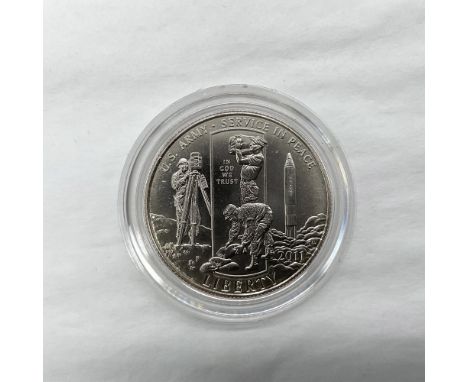 Denver Mint. The obverse side depicts a U.S. Army soldier surveying and two soldiers building a floodwall. A Redstone Army ro